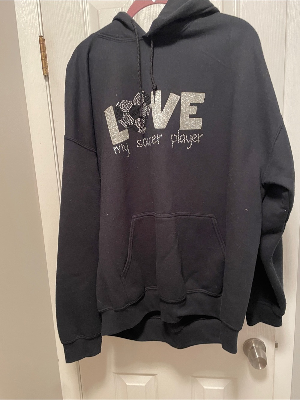 Women’s black, extra large soccer sweatshirt with bling bling